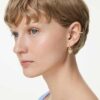Brincos pendentes Idyllia com ear cuff, cortes mistos, coração com chave, rosa, banhados a dourado Brincos pendentes Idyllia com ear cuff, cortes mistos, coração com chave, rosa, banhados a dourado