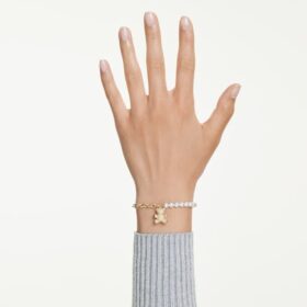 Pulseira Idyllia com pérola de cristal, corte redondo, ursinho, tom dourado, banhada a ouro Pulseira Idyllia com pérola de cristal, corte redondo, ursinho, tom dourado, banhada a ouro